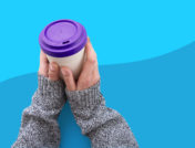Living with psoriasis - covered hands and coffee cup