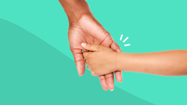 An adult holding hands with a child represents parents with mental illness