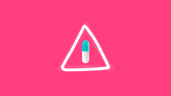 A capsule in a warning sign represents a drug recall