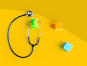 A stethoscope with blocks represents a well child check