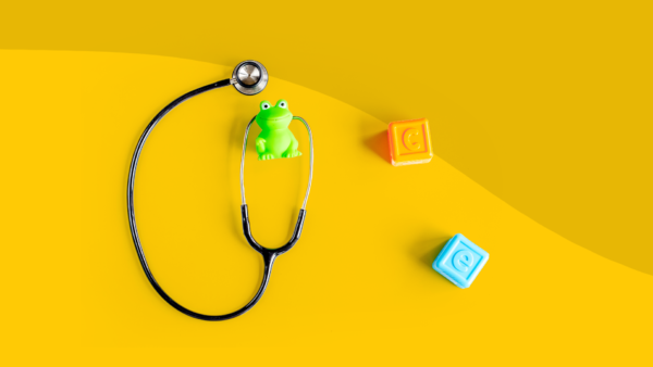 A stethoscope with blocks represents a well child check