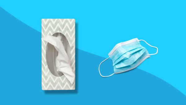 Tissues and a mask represent allergy symptoms vs coronavirus symptoms