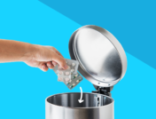 Hand reaching into trash can to throw away medications: How to dispose of medication