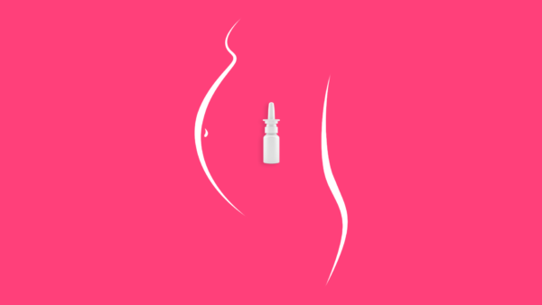 An image of a pregnant belly with nasal spray inside it represents taking allergy medicine while pregnant