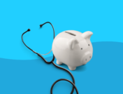 A piggybank and stethoscope represents healthcare costs