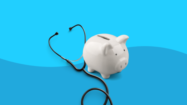 A piggybank and stethoscope represents healthcare costs