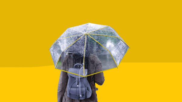 A woman with PMDD under an umbrella