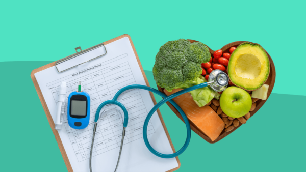 A clipboard and veggies represent living with diabetes