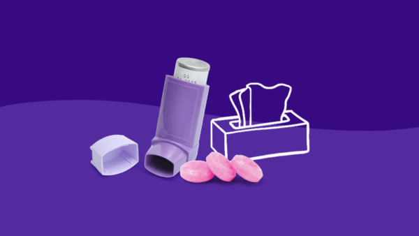 An inhaler and box of tissues represent viral induced asthma flare