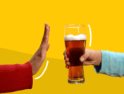 A hand saying no to a beer represents alcohol and coronavirus
