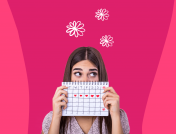 Woman holding a calendar: Questions for Well-Woman Exam