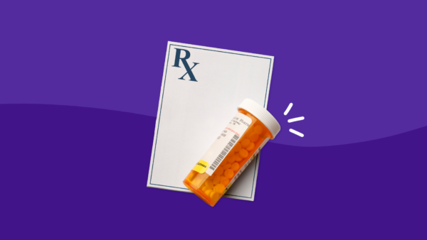 Prescription pad with pill bottle representing side effects of Prednisolone
