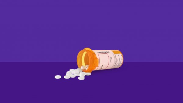 Spilled prescription bottle of pills: Compare common vs. serious Nexium side effects