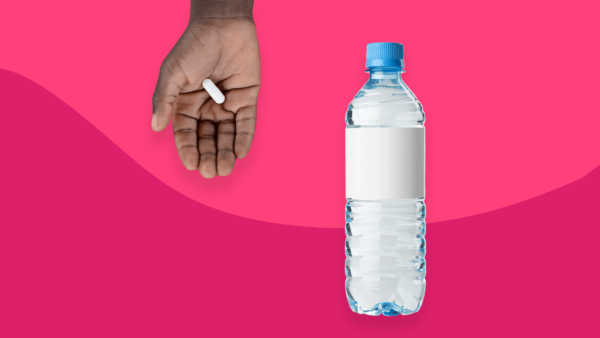 A hand and a bottle of water represent how to swallow a pill