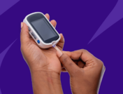A hand holding a dibetic glucose monitor: Does Medicare cover testing supplies?