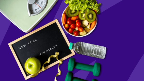 A weight loss plan with weights, fruit, and a scale