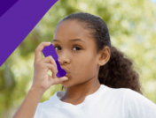 A girl with an inhaler represents early signs of asthma