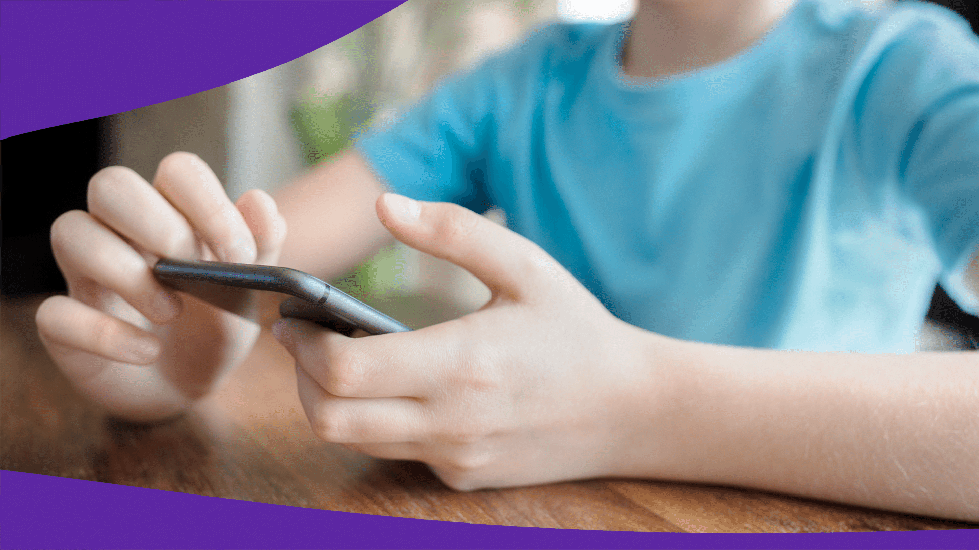 Teen boy scrolling through smart phone: What are the effects of cyberbullying?