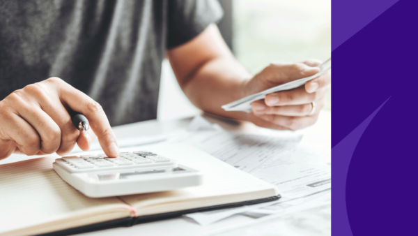 A man with a calculator represents standard pharmacist salaries