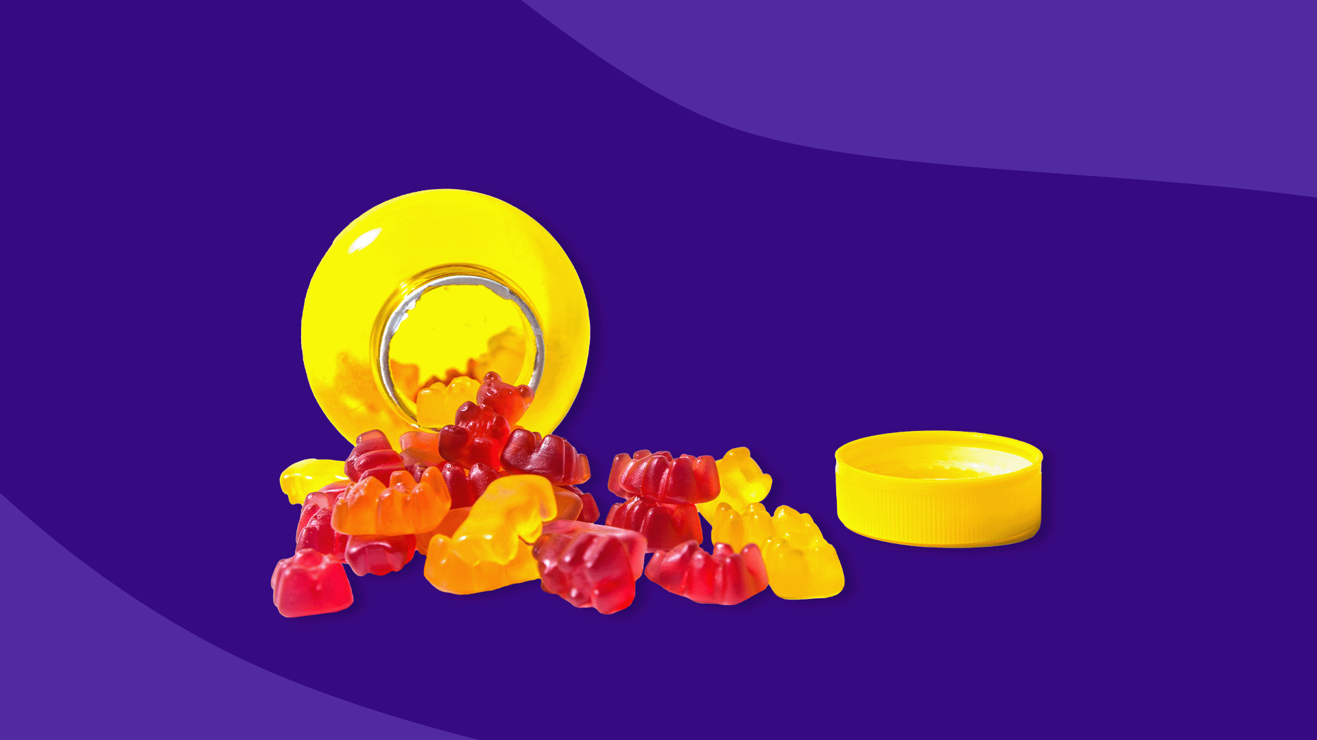 Gummy vitamins spilling out of a jar—are gummy vitamins effective?