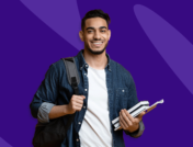 Student carrying books and smiling - pharmacy school requirements