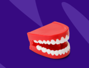 Fake teeth with Zzzs represents how to stop grinding teeth