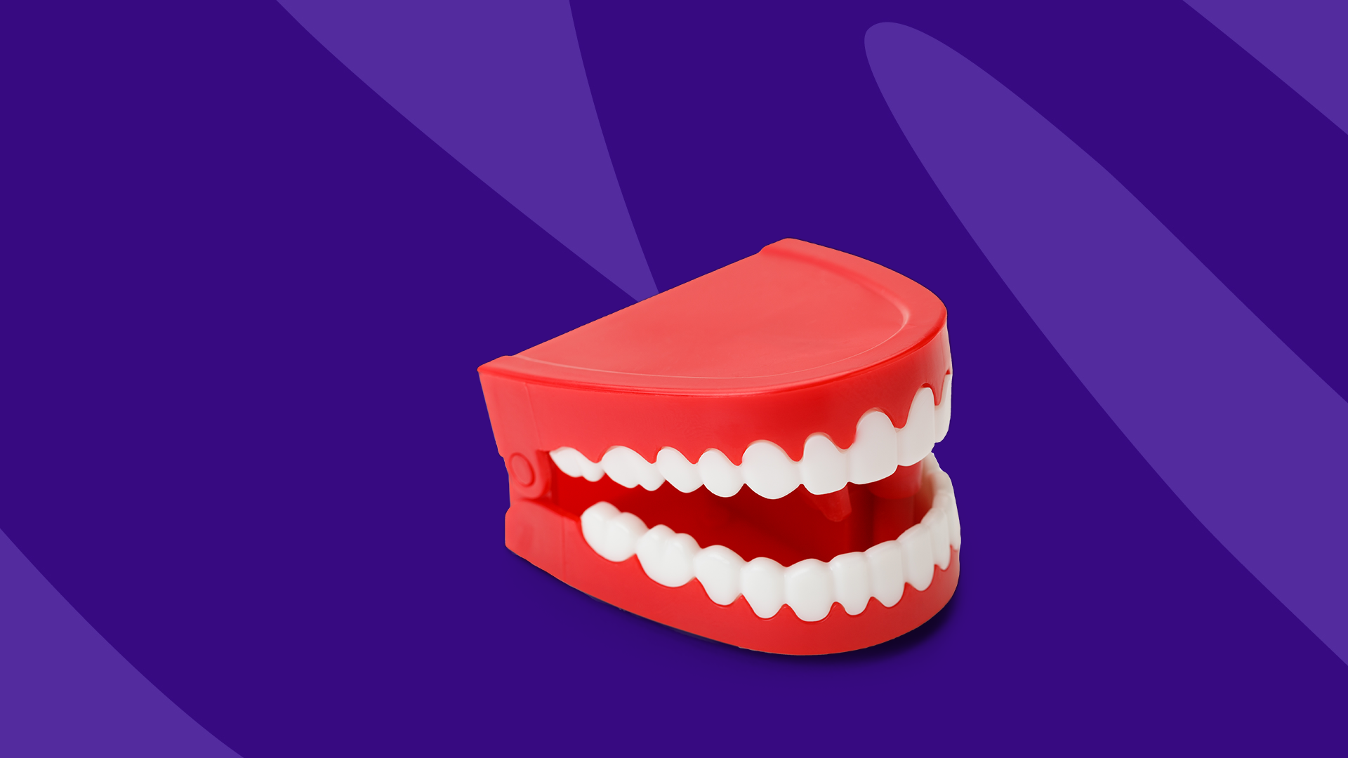 Fake teeth with Zzzs represents how to stop grinding teeth