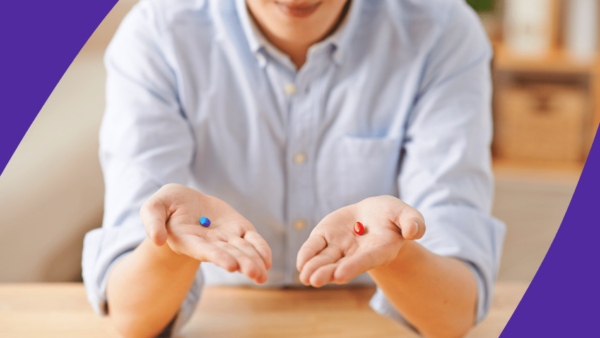 Man holding a blue pill in one hand and a red pill in another hand: Can you take Eliquis and Tylenol together?