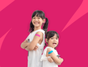 Two young children with bandaids on their arms - what shots do kids need for school