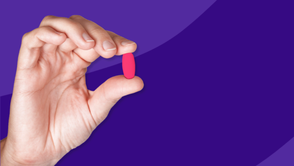 Hand holding Rx pill: Azithromycin side effects and how to avoid them