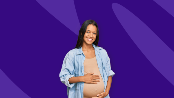 Pregnant person smiling - glucose test pregnancy