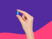 Hand holding blue Rx capsule: Atomoxetine side effects and how to avoid them