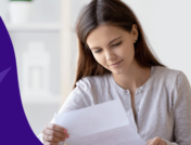 woman looking at a piece of paper - insurance appeal letter