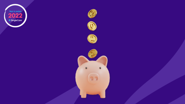 coins falling into a piggy bank - SingleCare reviews