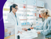 Pharmacist with a patient - copay card