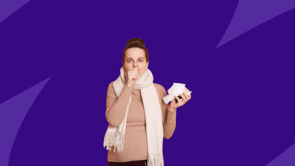 Pregnant woman holding tissues- strep throat while pregnant