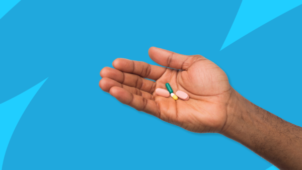 Hand holding Rx pills: Tamiflu alternatives