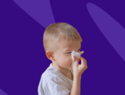 Boy blowing his nose - how to treat allergies in toddler