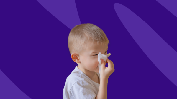 Boy blowing his nose - how to treat allergies in toddler