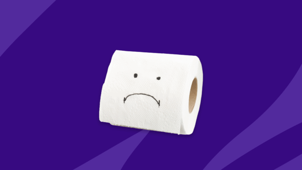 Toilet paper roll with a sad face