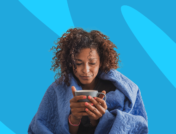 Woman wrapped in blanket holding mug: How long does mono last?