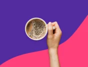 Hand holding a cup of coffee - Does coffee dehydrate you?