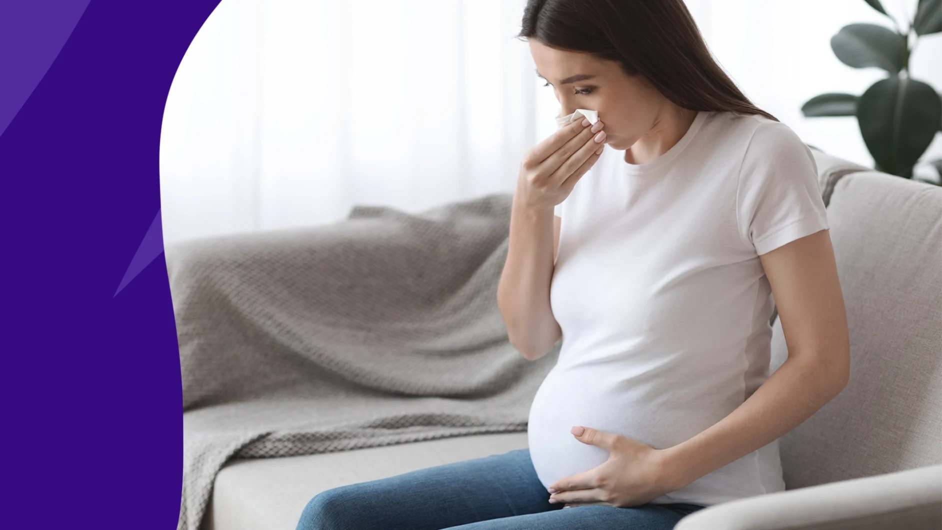 Pregnant woman holding a tissue to her nose - pregnancy safe cold medicine