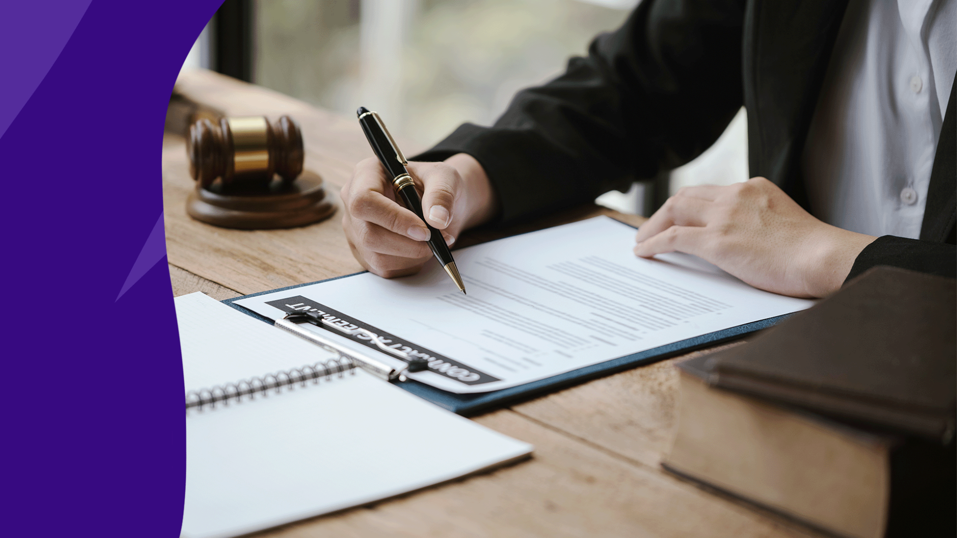Lawyer sitting at desk with clipboard holding a pen: Medical power of attorney
