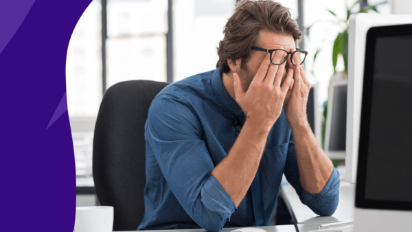 Someone holding their temples in pain: Right temple headache