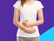 A woman holding her stomach | stomach flu remedies