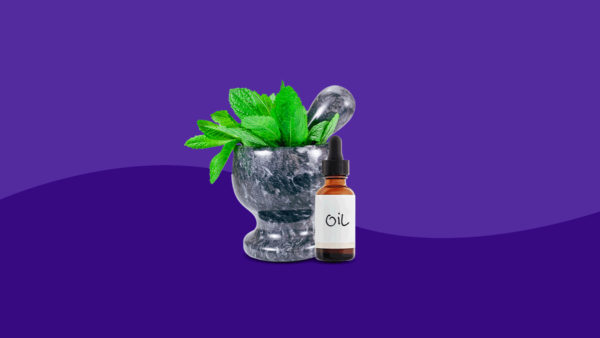 A mortar and pestle with leaves in it and a bottle of essential oils: Home remedies for mouth sores