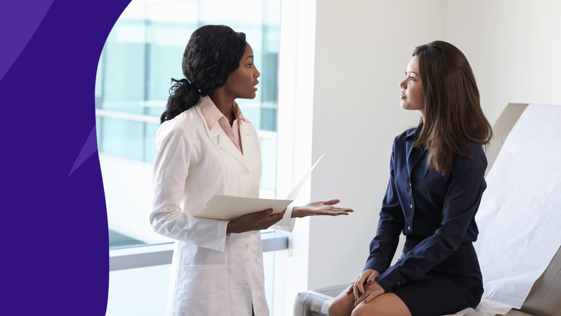 Femal medical professional talking to female patient in exam room: saw palmetto benefits for women