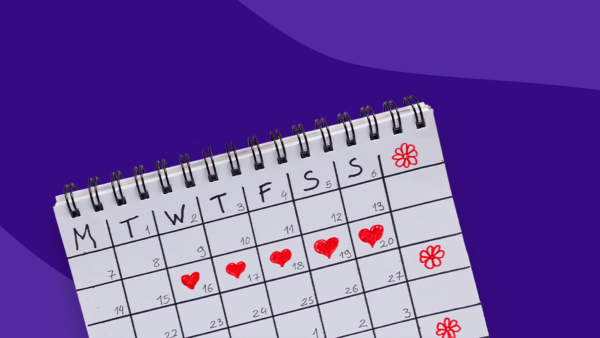 A calendar with hearts on five days of the week: What causes spotting before your period?