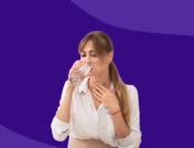 Woman drinking a glass of water and holding her throat: Why does my throat hurt when I wake up?